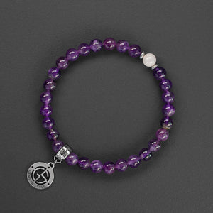Amethyst and Rose Quartz natural gemstone bracelet with silver charm by Gems In Style Jewellery.