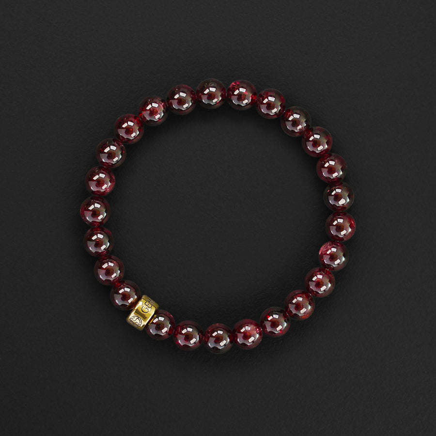 Garnet natural gemstone bracelet with branded gold charm by Gems In Style Jewellery. Customised size, comes in a gift box.