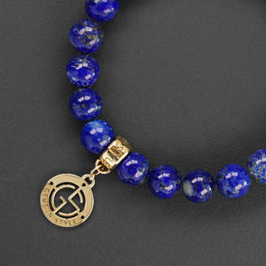 Lapis Lazuli natural gemstone bracelet with branded gold charm by Gems In Style Jewellery.