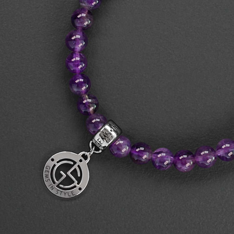 Amethyst and Rose Quartz natural gemstone bracelet with silver charm by Gems In Style Jewellery.