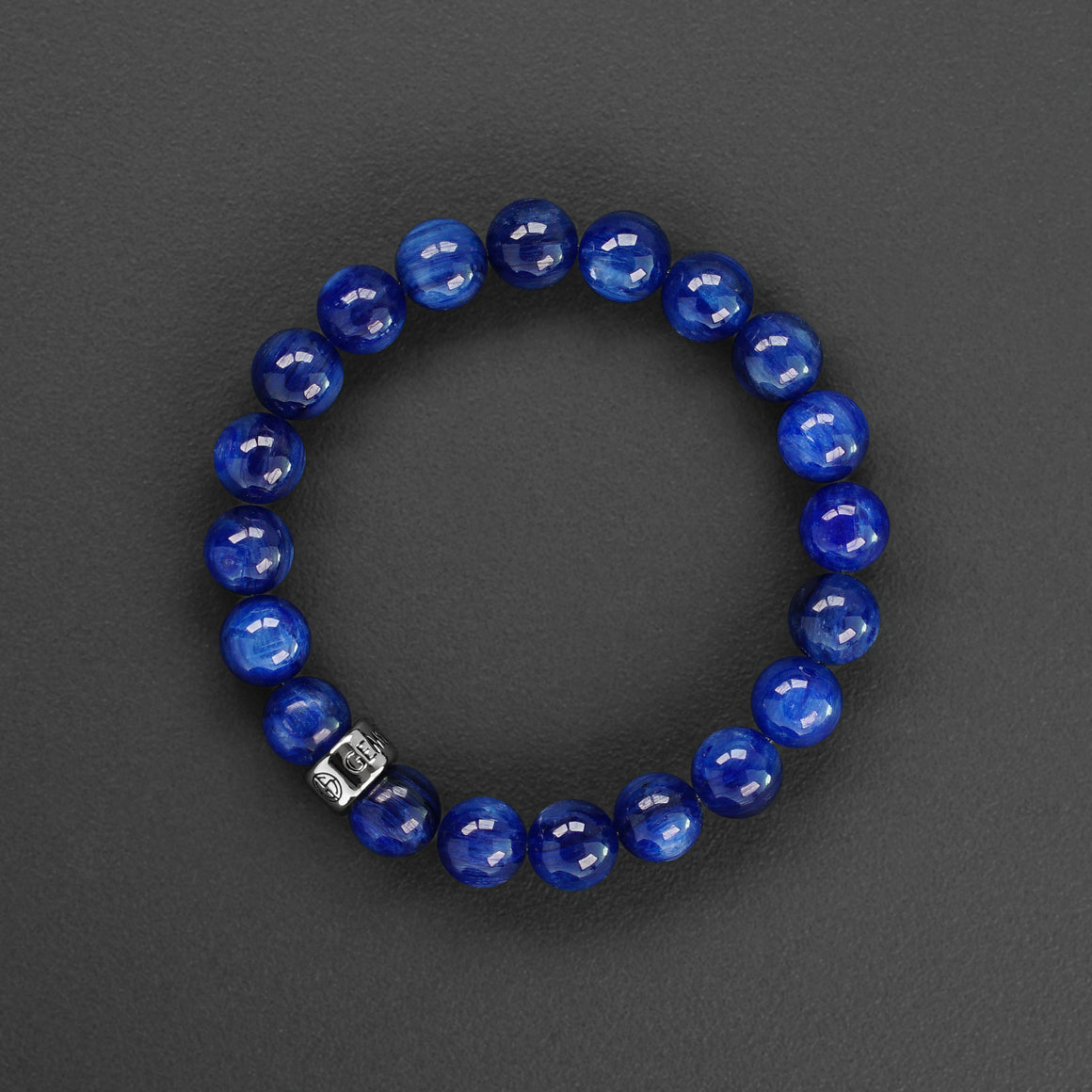 Blue Kyanite gemstone bracelet with silver charm by Gems In Style Jewellery.