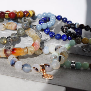 Natural gemstone bracelets with silver and gold charms by Gems In Style Jewellery