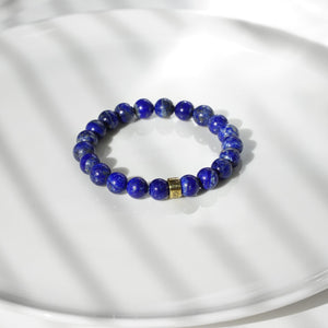 Lapis Lazuli natural gemstone bracelet with branded gold charm by Gems In Style Jewellery.