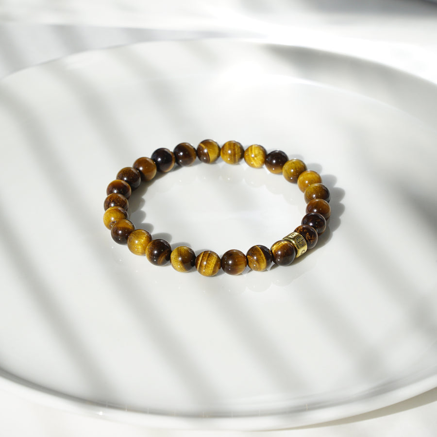 Tiger Eye natural gemstone bracelet with gold charm by Gems In Style Jewellery.